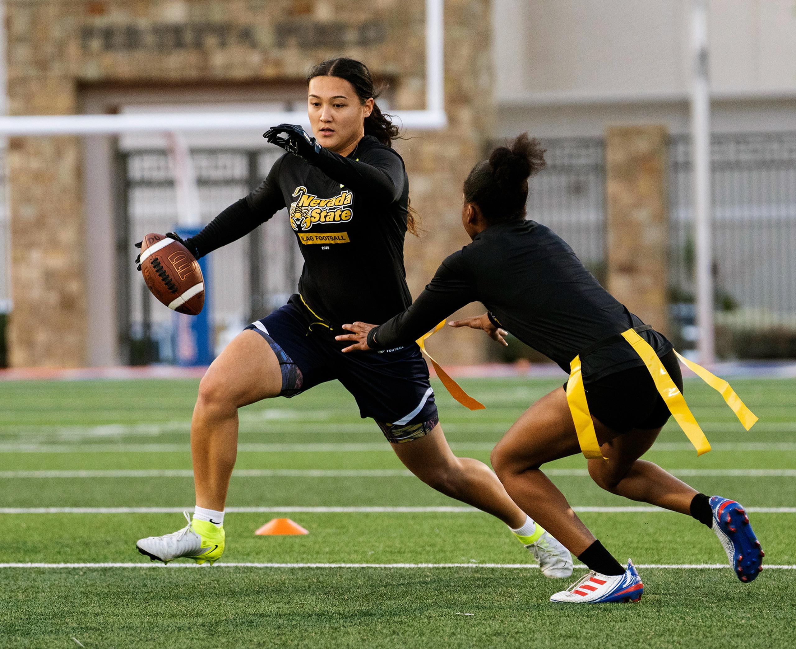 Player catching a football with perfect form, showcasing the quick strikes that define Nevada State's approach