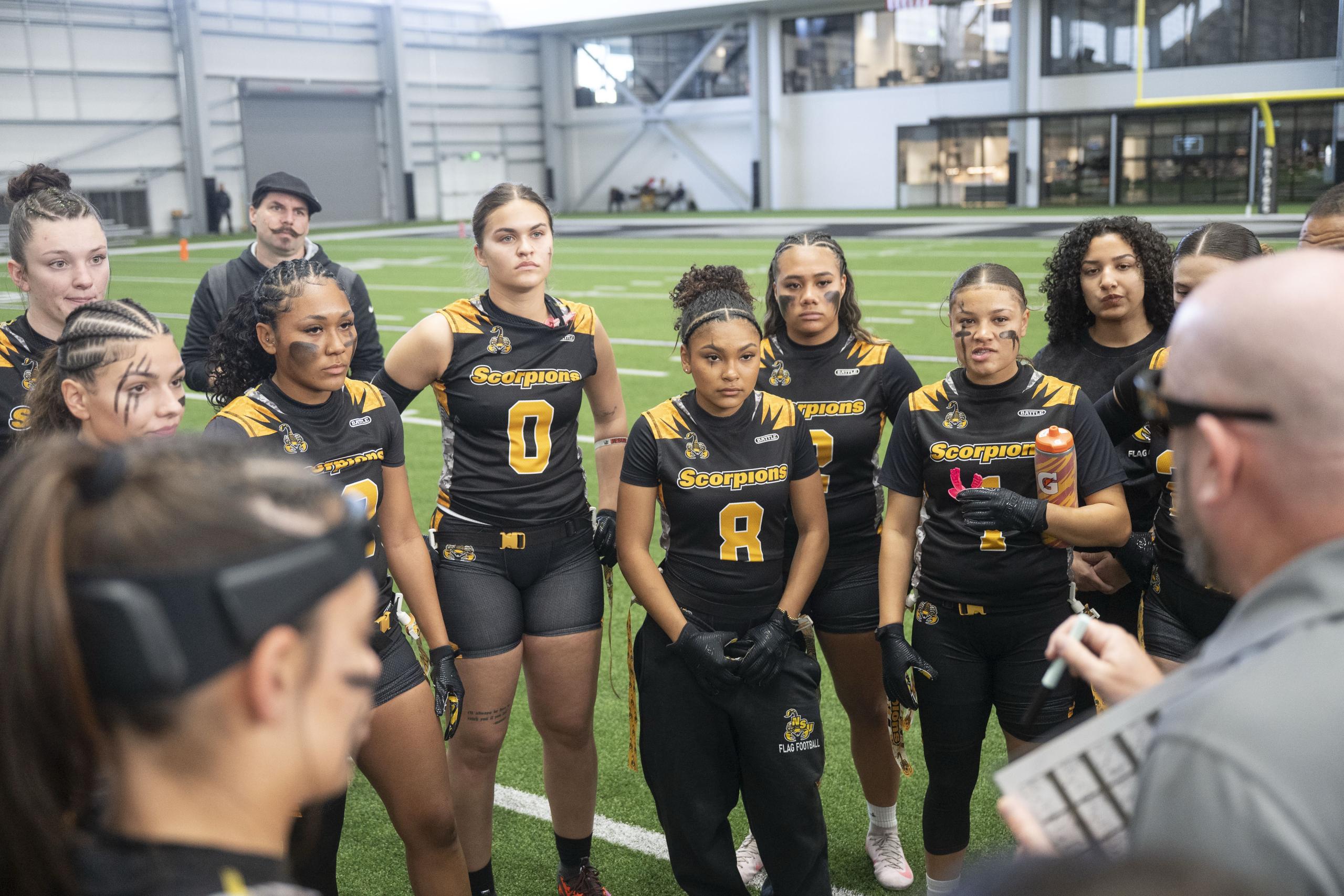 Nevada State University players huddle up before their first game against La Sierra University